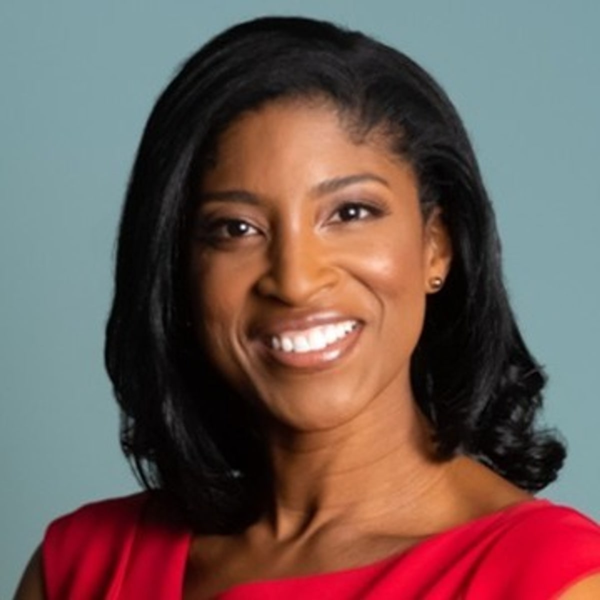 Portrait of Najoh Tita-Reid, Fellow at Alpha Governance Group